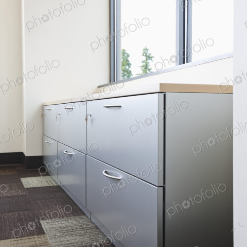 Filing cabinet and window in office. Filing cabinet and window in office.