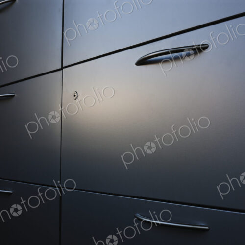 Filing cabinet with handle.