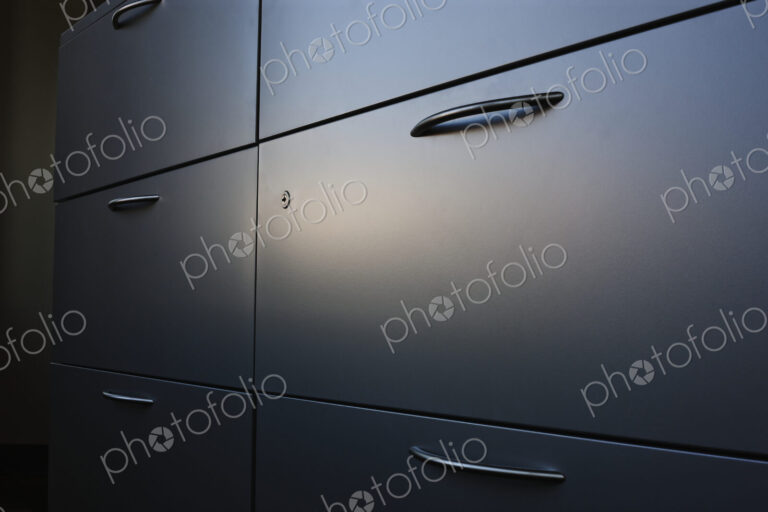 Filing cabinet with handle.