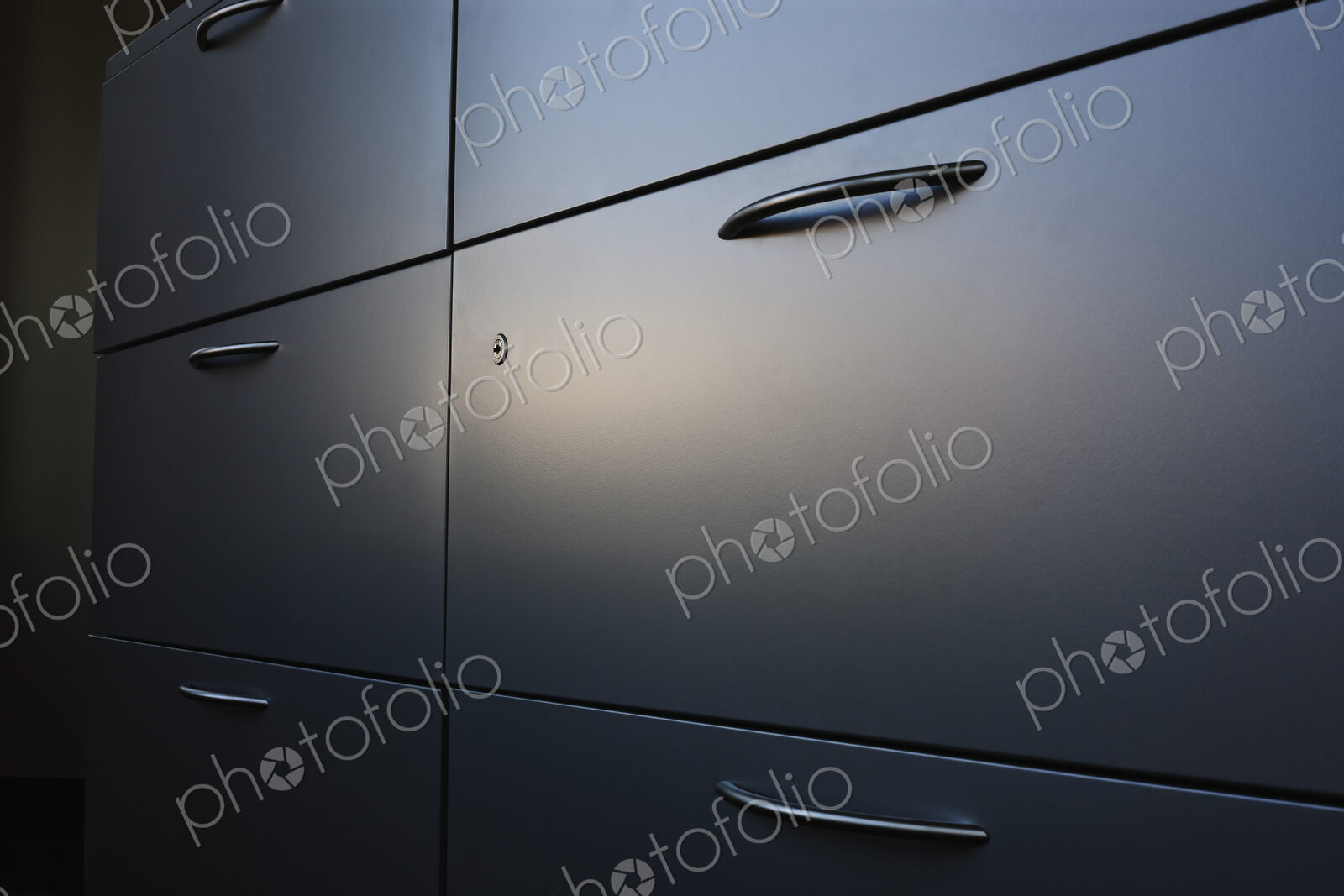 Filing cabinet with handle.
