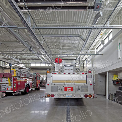 Fire Trucks in a Firehouse Bay