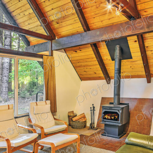 Fireplace and armchairs in rustic living room