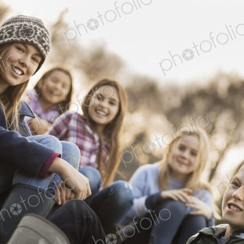 Five children on a farm. Boys and girls in warm jackets outdoors. Five children on a farm. Boys and girls in warm jackets outdoors.