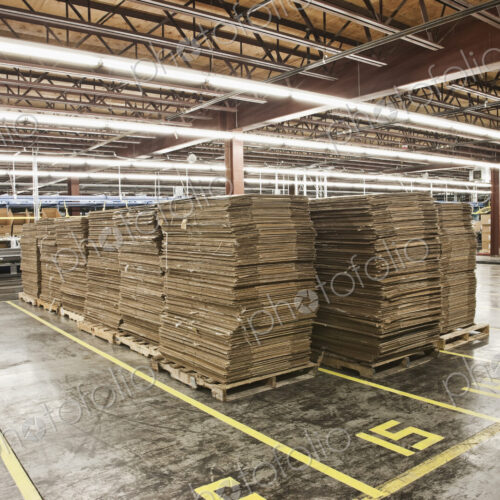 Flattened cardboard boxes in warehouse Flattened cardboard boxes in warehouse