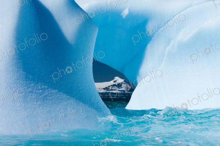 Floating icebergs framing a view of the ocean, Antarctica