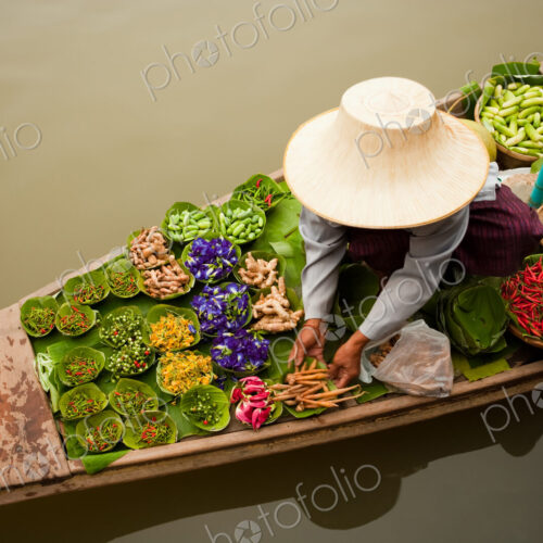 Floating markets are a common tradition throughout Southeast Asia. Bangkok, Thailand. Floating markets are a common tradition throughout Southeast Asia. Bangkok, Thailand.