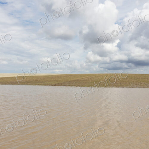 Flooded farmland and overcast sky