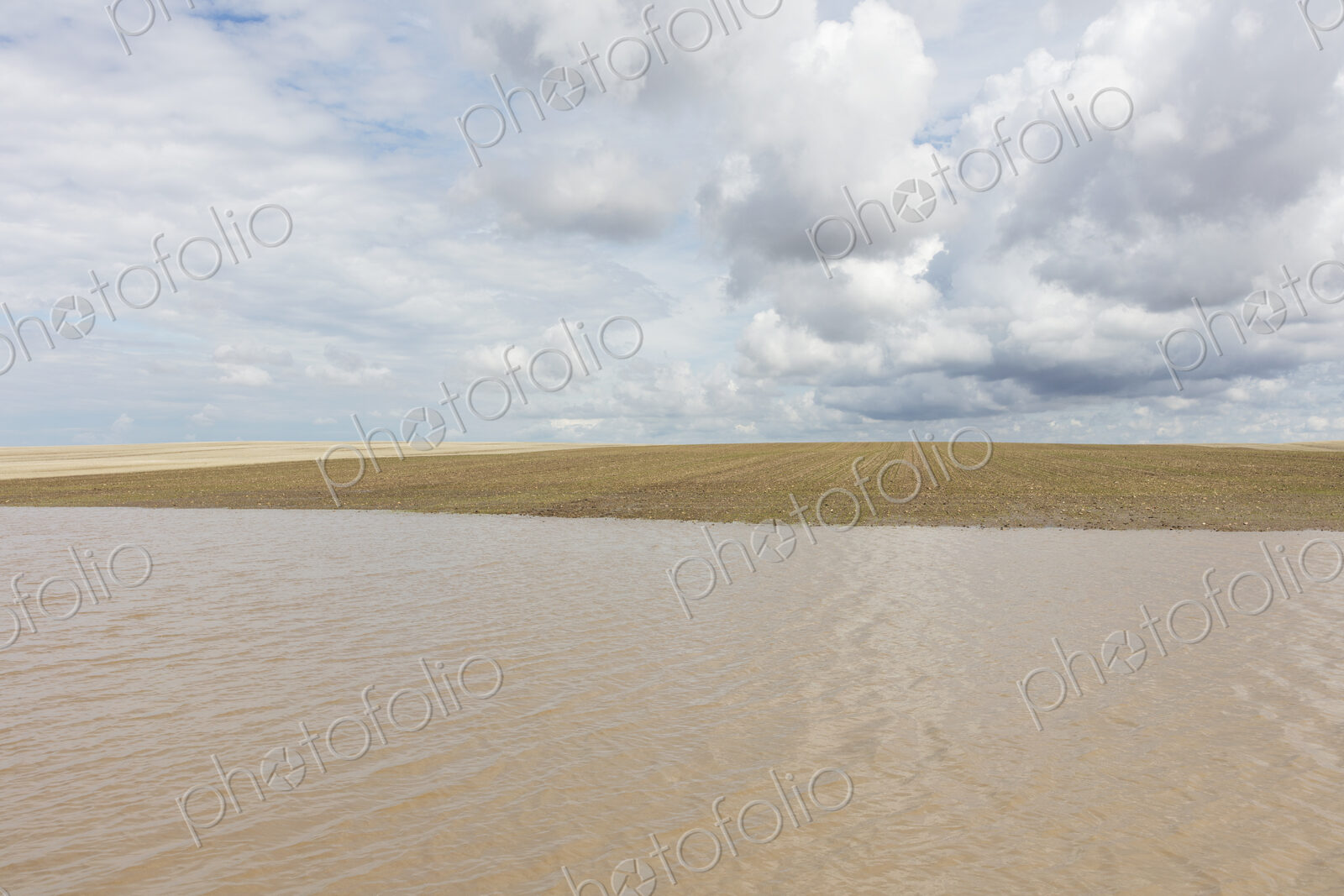 Flooded farmland and overcast sky