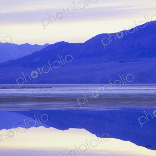 Flooded salt flats at dawn and Panamint Mountains in distance. Flooded salt flats at dawn and Panamint Mountains in distance.