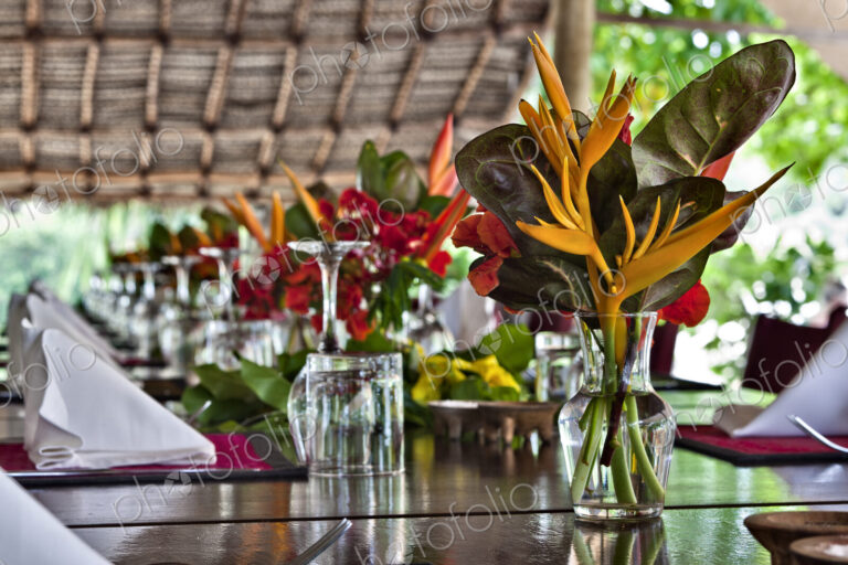 Flowers On Open Air Restaurant Dining Table
