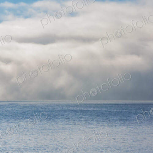 Fog and clouds clearing on East Sound, Orcas Island.