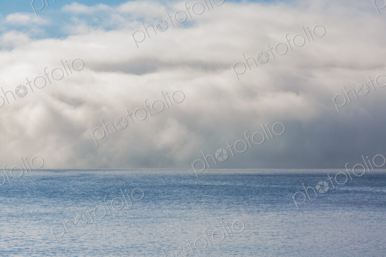 Fog and clouds clearing on East Sound, Orcas Island.