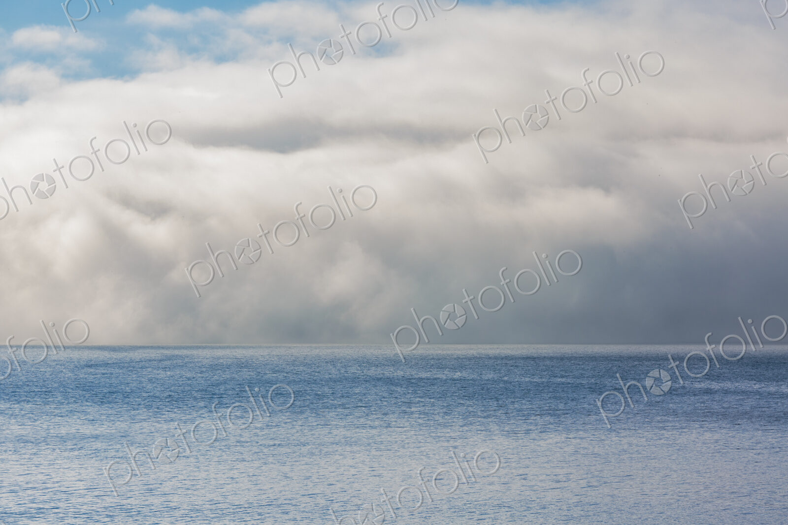 Fog and clouds clearing on East Sound, Orcas Island.