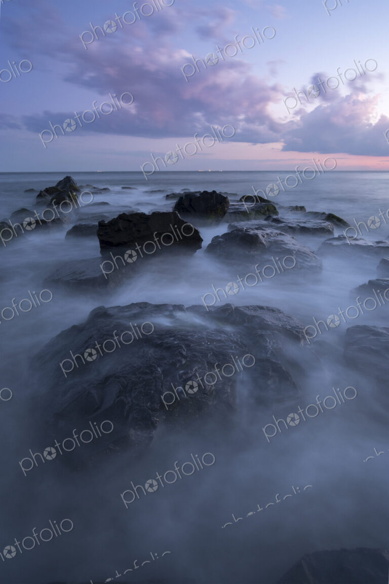 Fog on rocks at ocean