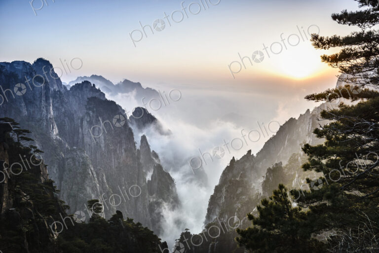 Fog rolling over rocky mountains, Huangshan, Anhui, China