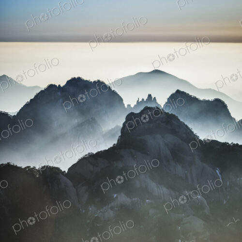 Fog rolling over rocky mountains, Huangshan, Anhui, China, Fog rolling over rocky mountains, Huangshan, Anhui, China,