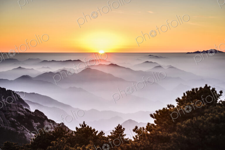 Fog rolling over rocky mountains, Huangshan, Anhui, China