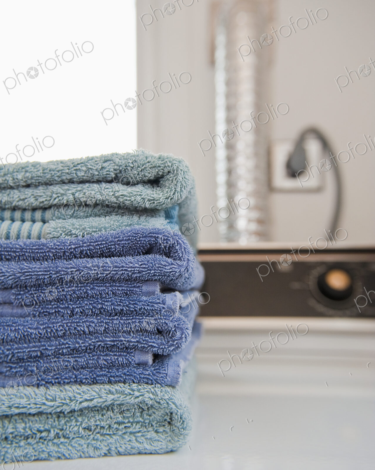 Folded Towels on a Dryer