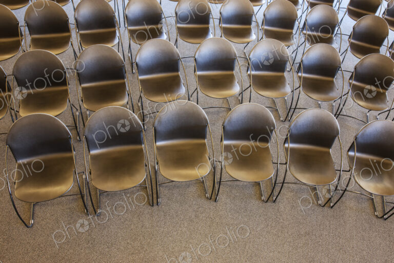 Folding chairs lined up for a business meeting