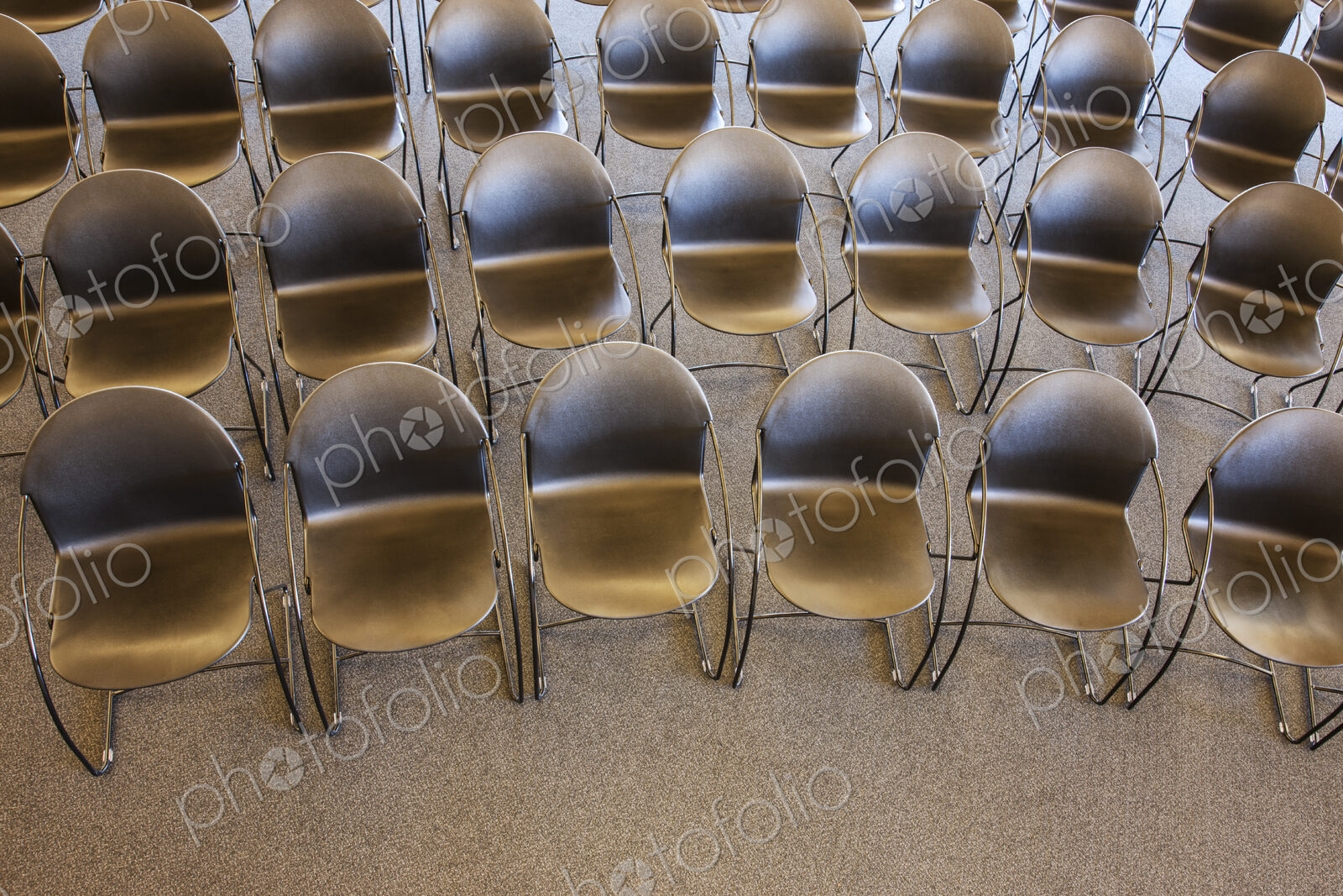 Folding chairs lined up for a business meeting