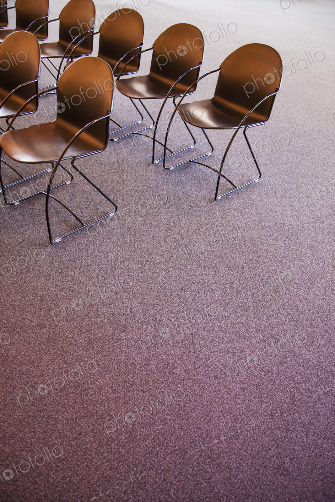 Folding chairs lined up for a business meeting