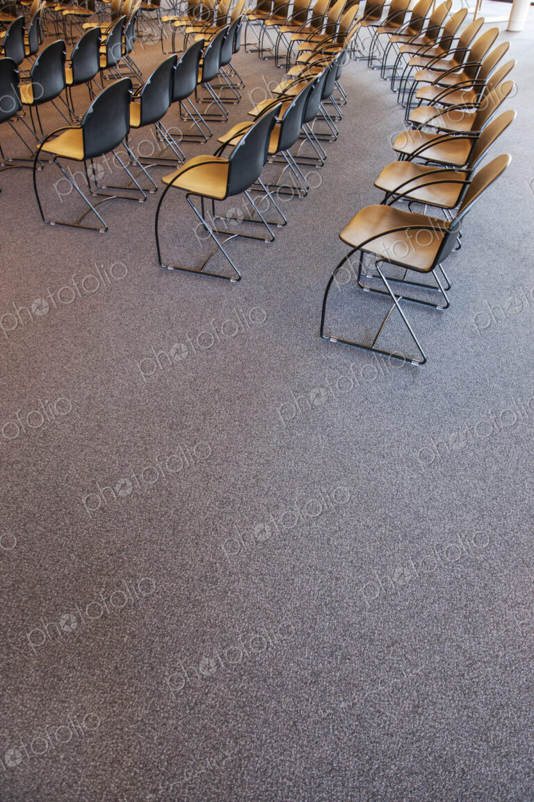 Folding chairs lined up for a business meeting
