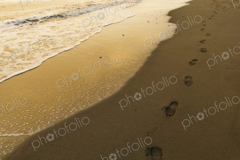 Footprints of a person on a beach, Freshwater Bay.