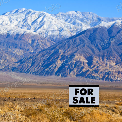 For Sale Sign in Mountainous, Desert Landscape