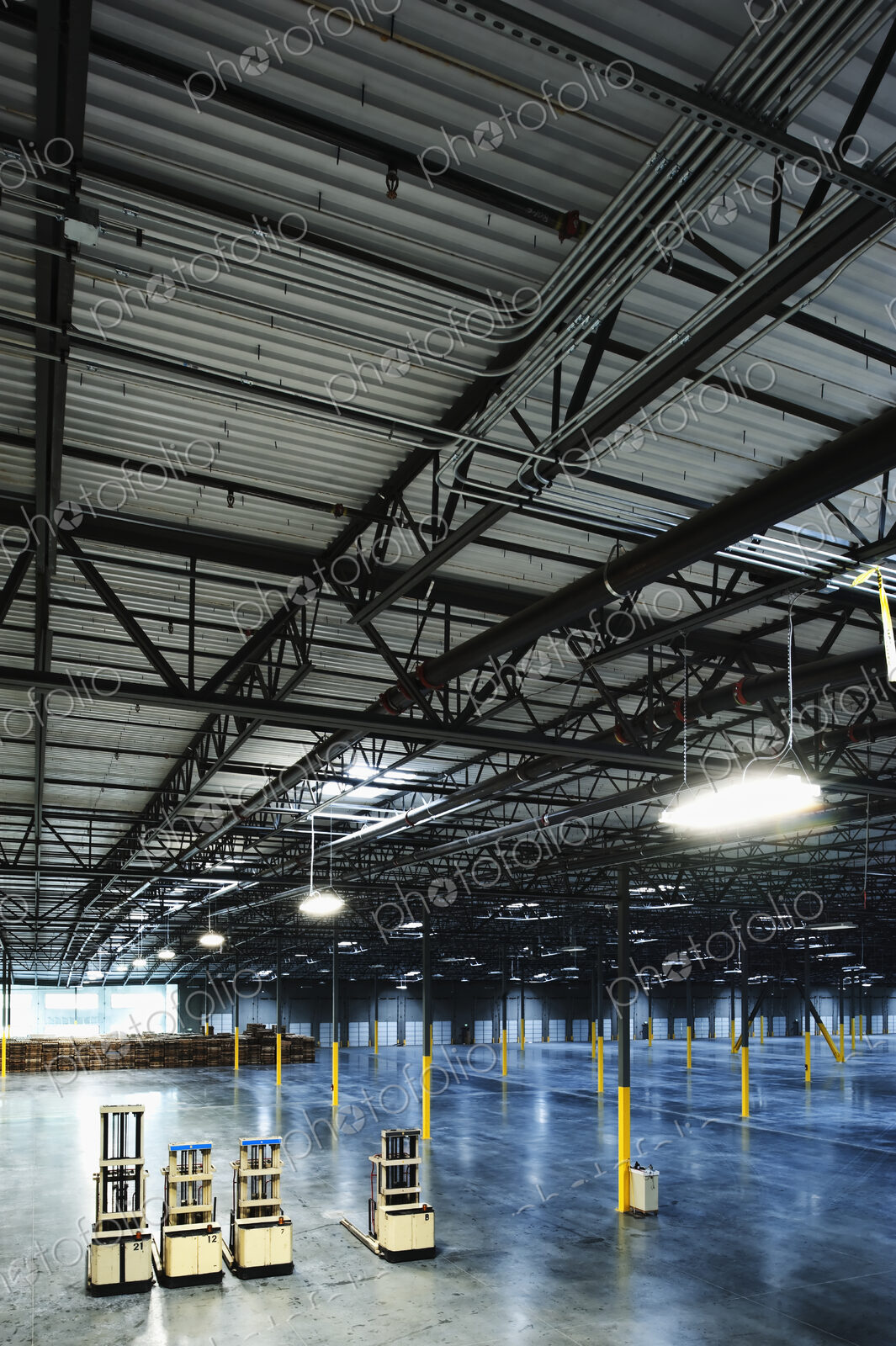 Forklifts in warehouse