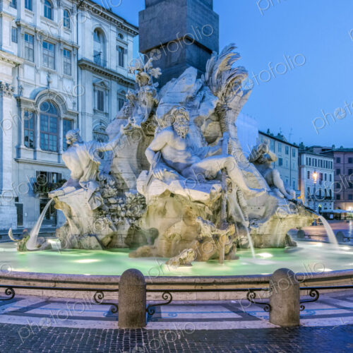 Four Rivers Fountain illuminated at night, Rome, Italy