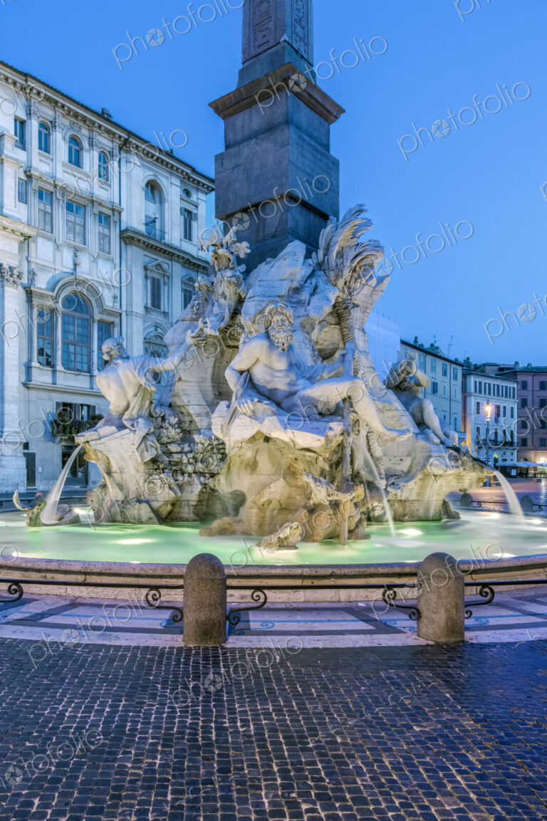 Four Rivers Fountain illuminated at night, Rome, Italy