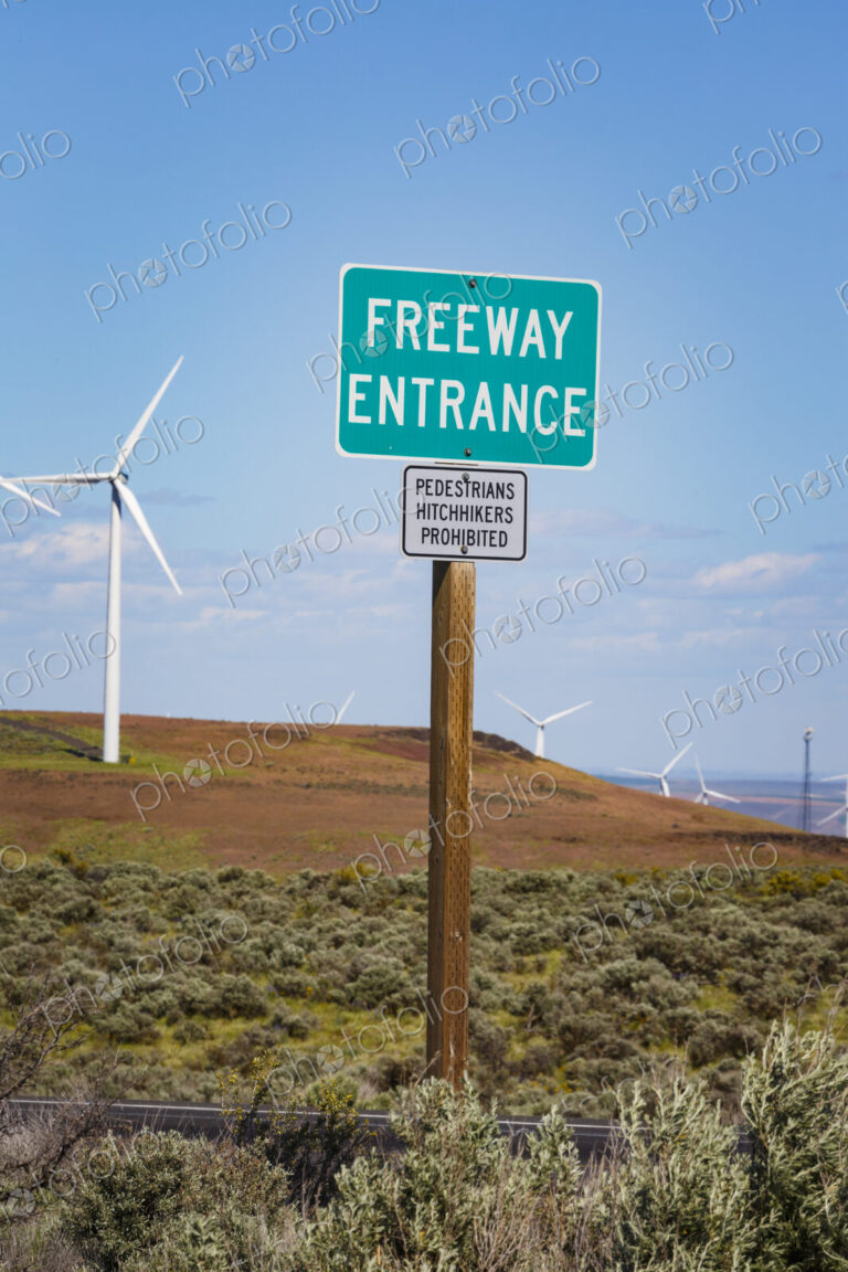 Freeway Entrance road signs along the roadside in the rolling landscape of Kittikas…