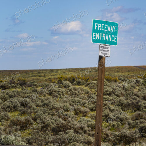 Freeway Entrance signs along the roadside in the rolling landscape of Kittikas county. Freeway Entrance signs along the roadside in the rolling landscape of Kittikas county.