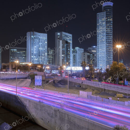 Freeway Passing Downtown Buildings At Night Freeway Passing Downtown Buildings At Night