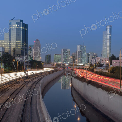 Freeway Passing Downtown Buildings At Night Freeway Passing Downtown Buildings At Night