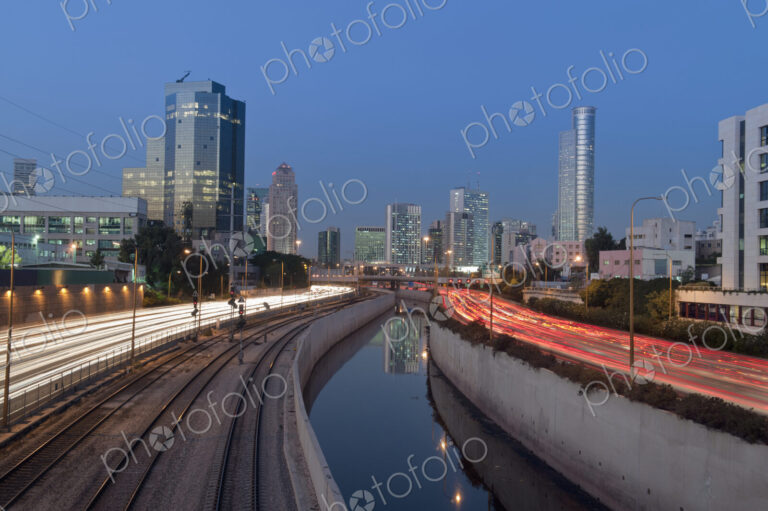 Freeway Passing Downtown Buildings At Night
