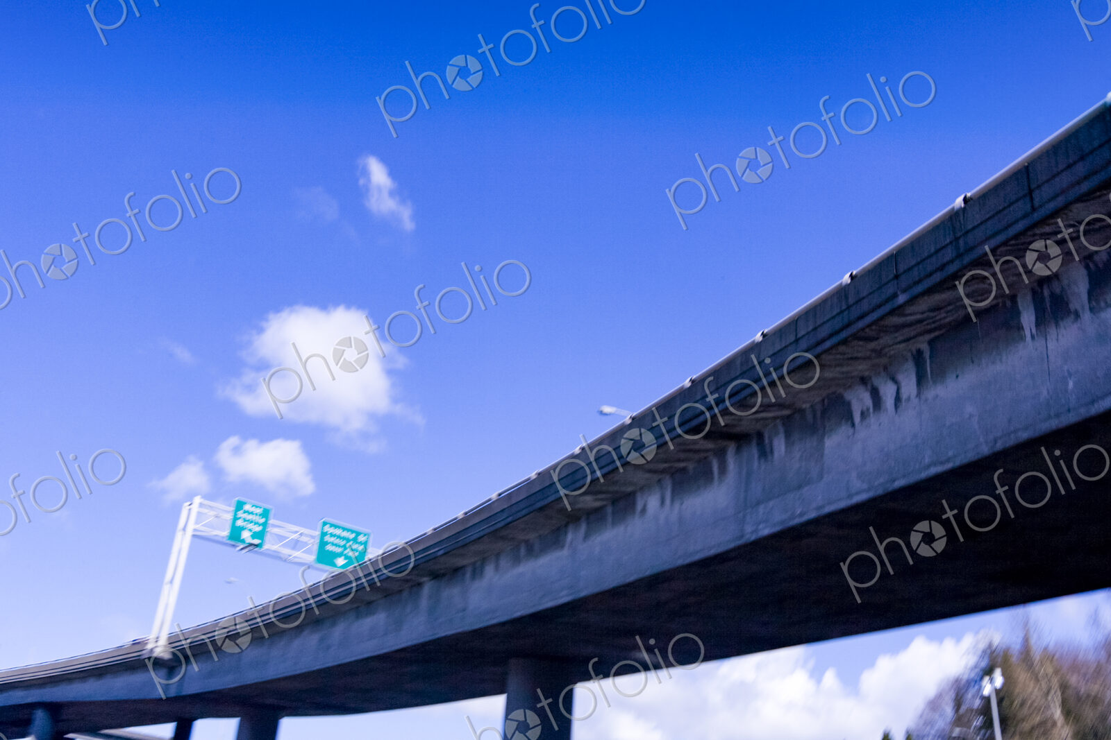Freeway overpass, low angle view of the flyover against a blue sky, Seattle, WA, USA