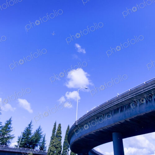 Freeway overpass, low angle view of the flyover against a blue sky, Seattle, WA, USA