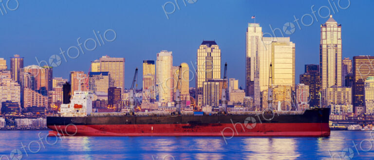 Freighter near cityscape, Seattle, Washington, United States