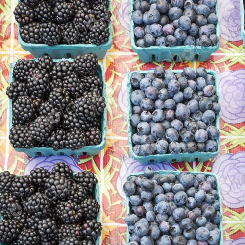 Fresh blackberries, raspberries, blueberries, and strawberries in baskets at a Seattle… Fresh blackberries, raspberries, blueberries, and strawberries in baskets at a Seattle…