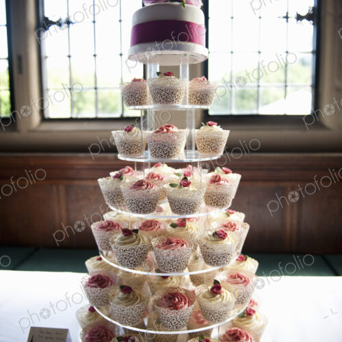 Frosted cupcakes on a seven tier cake stand, a cupcake wedding cake.