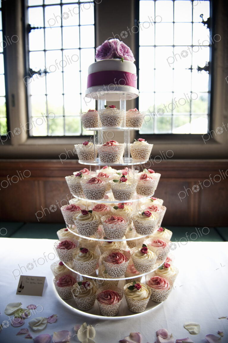 Frosted cupcakes on a seven tier cake stand, a cupcake wedding cake.