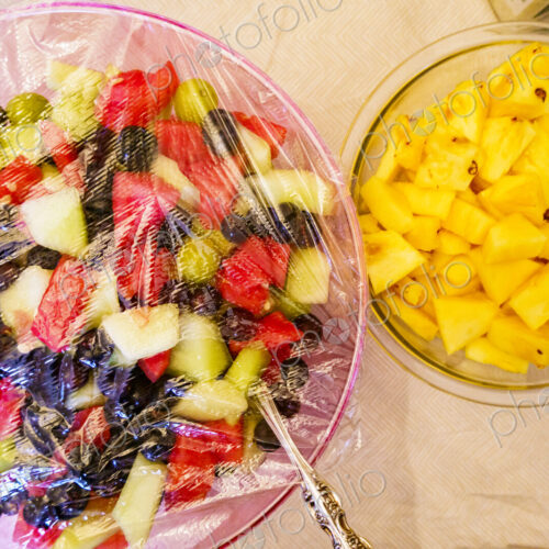 Fruit salads in glass bowls.
