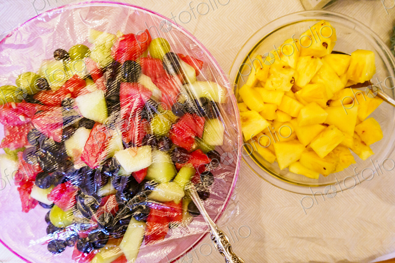 Fruit salads in glass bowls.