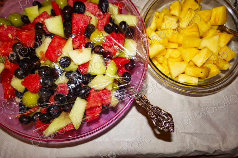 Fruit salads in glass bowls.