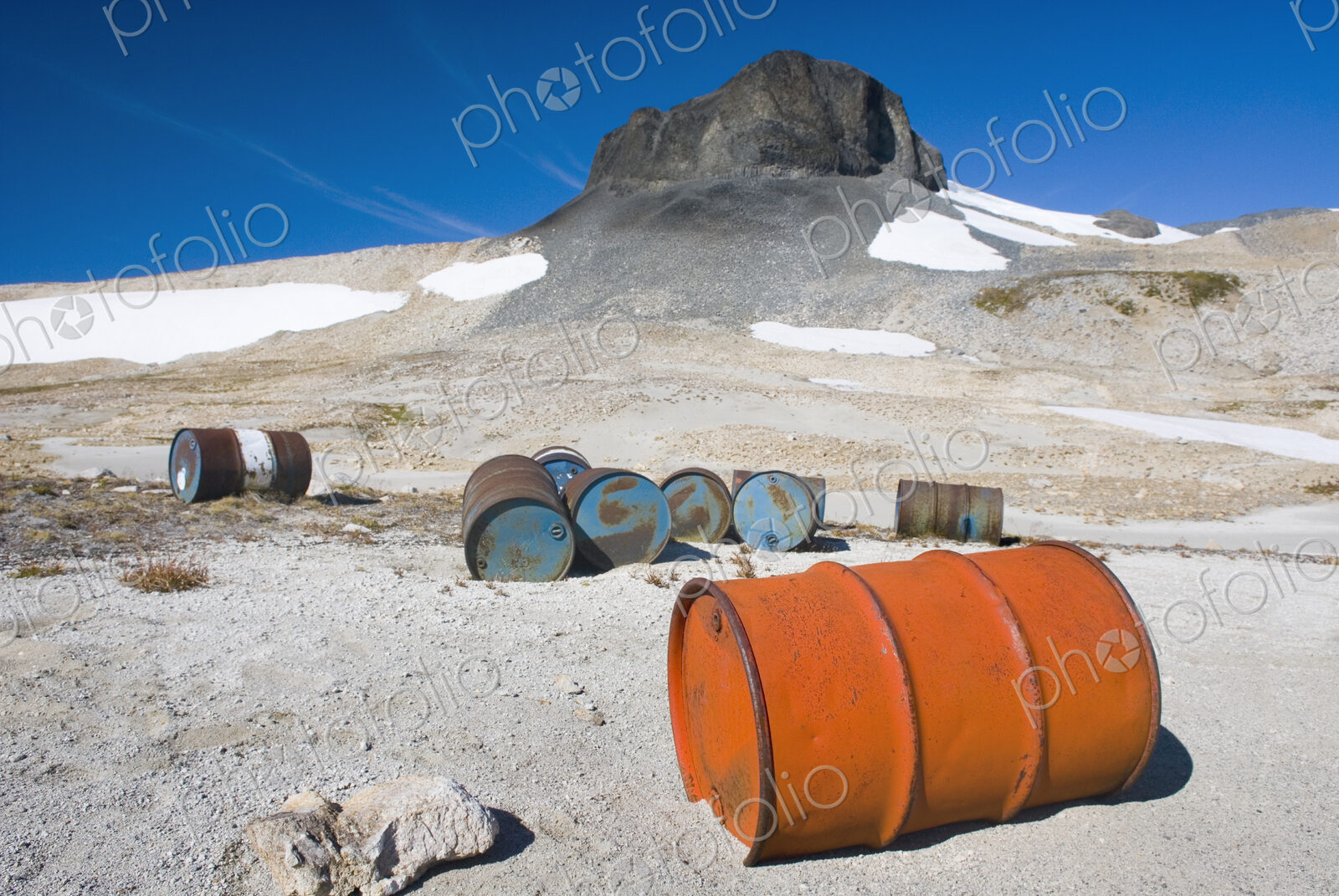 Fuel drums abandoned by miners and left to rust and leak into the wilderness watershed…