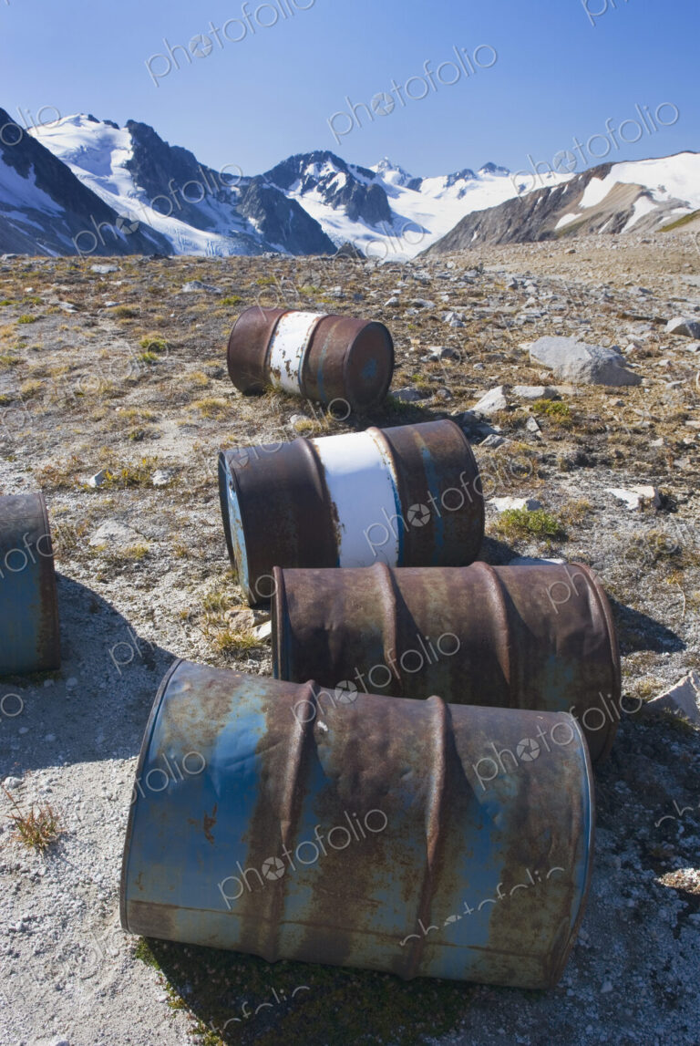 Fuel drums abandoned by miners and left to rust and leak into the wilderness watershed…