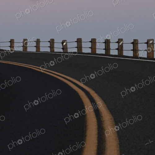 Full Moon Over a Curving Road