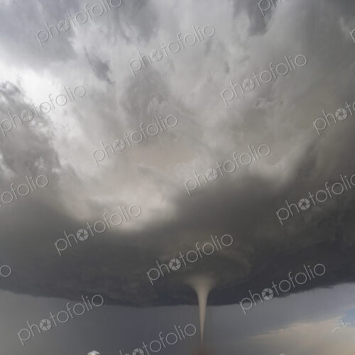 Fully Condensed Tornado, a rotating column of air reaching to the ground, a defined shape. Fully Condensed Tornado, a rotating column of air reaching to the ground, a defined shape.