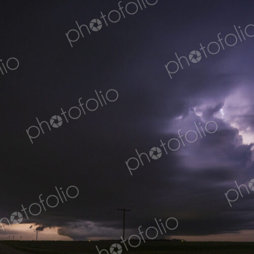 Fully Developed Wedge Tornado on the Ground after Sunset with Lightning in the Supercell